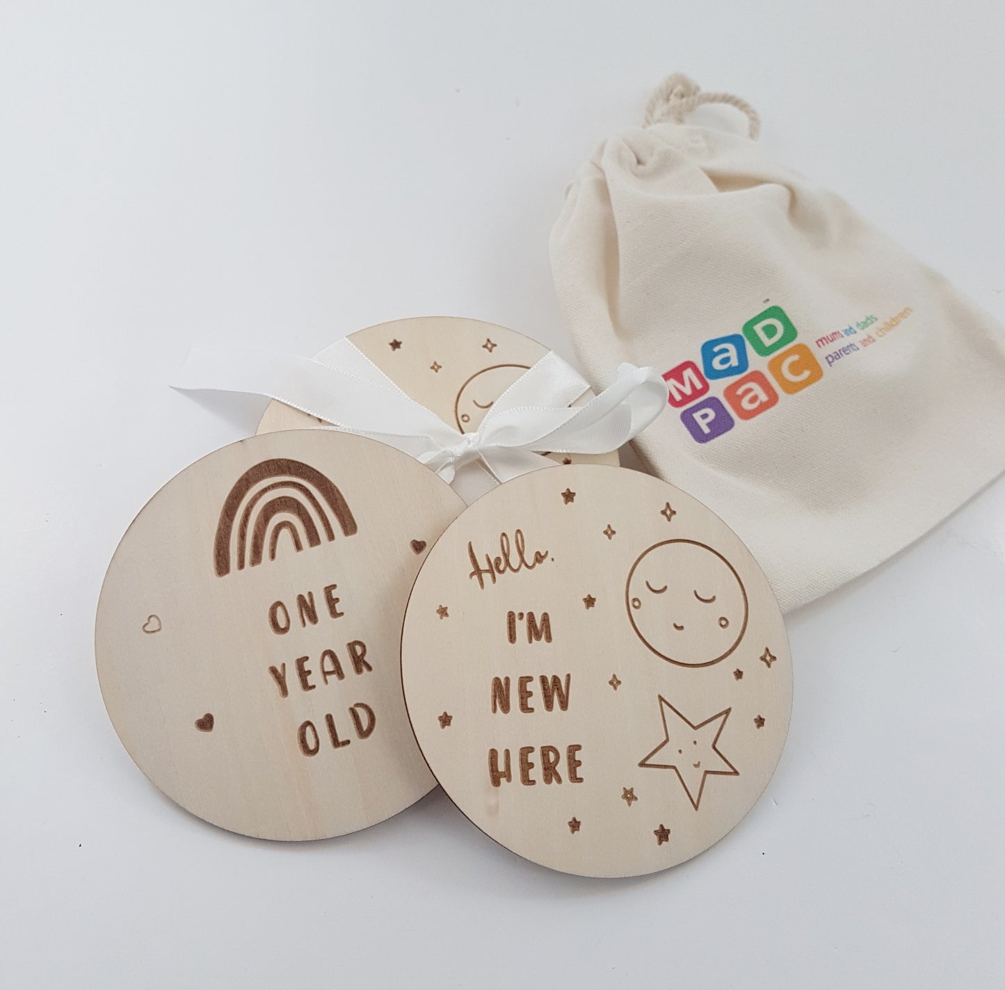 14 Wooden Baby milestone discs (2 designs - Rainbow and Moon) with a little cotton bag. 7 reversible discs